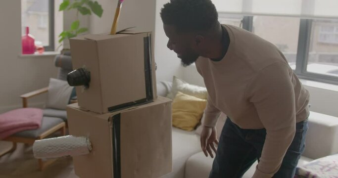 Father and Child playing with Robot at Home