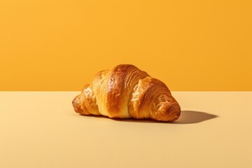 Freshly baked croissant on a yellow background. Created with Generative AI tools
