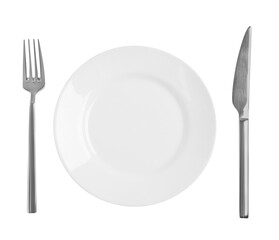 Clean plate and shiny cutlery on white background, top view
