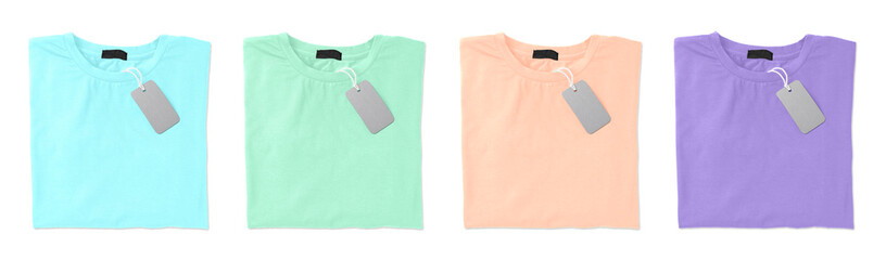 Set of pastel stylish t-shirts with labels on white background, top view