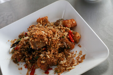 Roasted crispy belly pork with salt and chili. Combination Thai Food and Chinese Food Style top view.