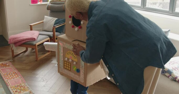 Mother and Son playing with Robot at Home