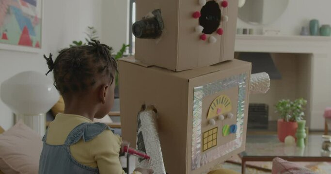Mother and Son playing with Robot at Home