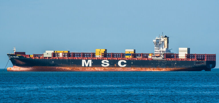 Big container ship MSC Meline is ancored at Vancouver harbour.