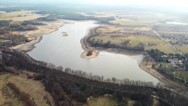 Filling a large pond for fishing purposes. Trebon. Czechia.
