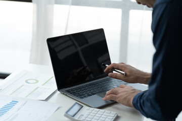 business people working on laptops Analyze business documents with graphs. financial chart Calculate market performance report on digital tablet business data analysis concept.