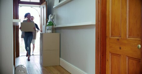 Moving, box and running with family in new house for real estate, happy and homeowner investment. Property, rent and sale with parents and kids in front door of home for purchase, excited or purchase