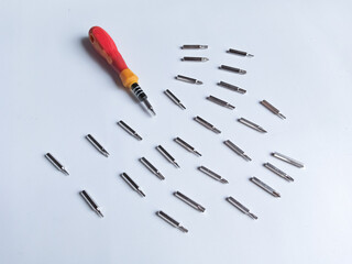 The screw-driver with a set of various nozzles. Interchangeable screwdriver set with different...