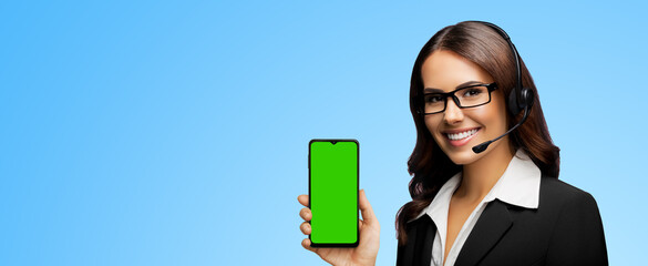 Customer support phone operator in glasses, headset hold show smartphone cell phone mobile green...
