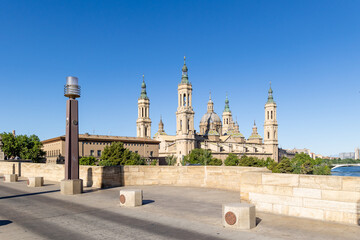 Zaragoza, Spain - May 01, 2023: tourists strolling in the square in front of the basilica of El Pilar in Zaragoza, Spain