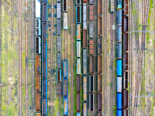 Aerial view landscape. View of trains, cars, cargo and tracks. Photo from a drone.