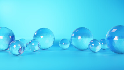 水色背景に球体の透明ガラス。（横長）