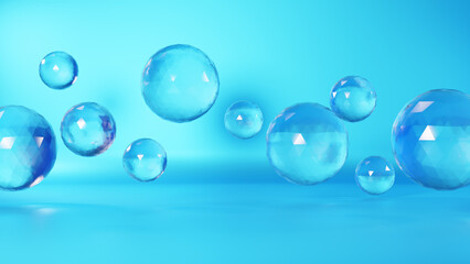 水色背景に宙に浮く球体の透明ガラス。（横長）