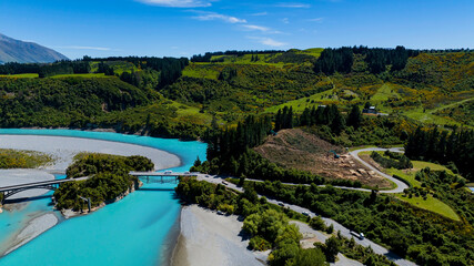 Fototapeta premium Aerial view of the car on the beach wuth road curve as the nature image background