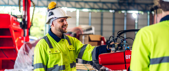 Obraz premium Professional team labor machanic engineer technician worker industrial work control with machine, manufacturing, factory, production line, Indusry 4.0, robot, industrial facility.business planning