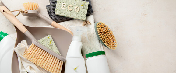 Eco brushes and cleaning products on light background.  Eco Cleaner concept.