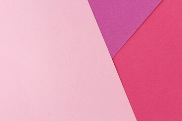 Pink and purple color paper flat lay background