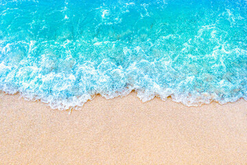 Fototapeta na wymiar Soft blue ocean wave on sandy beach. Summer background