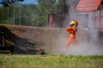 Brave firefighters navigate the outdoor location their shoulders burdened by the weight of fire...