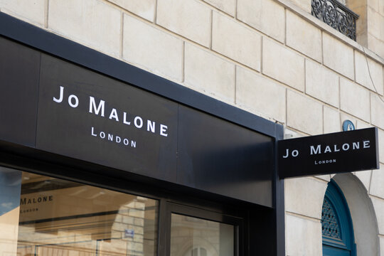 jo malone london logo brand and text sign on wall facade shop entrance in city
