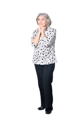 full length, happy senior woman posing isolated on white background