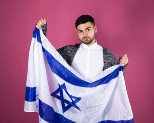 Young attractive man with the Israeli flag. Happy man.	