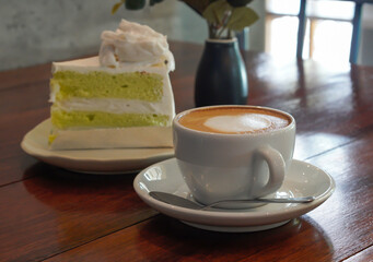 Hot latte and coconut cake in a warm atmosphere 