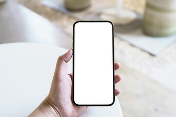 Women's hands holding cell telephone blank copy space screen. smartphone with blank white screen isolated. smart phone with technology concept.