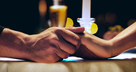 Holding hands, candle and couple on dinner date at restaurant, hotel or love on marriage...