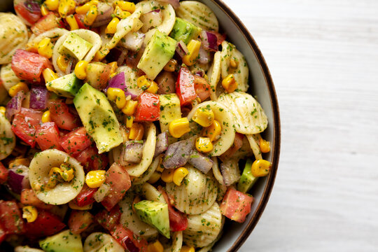 Homemade Grilled Corn Summer Pasta Salad In A Bowl, Top View. Flat Lay, Overhead, From Above. Copy Space.