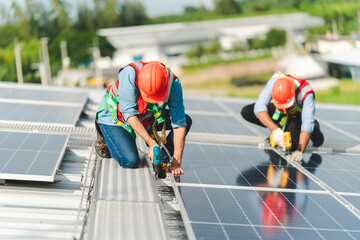 Technician engineer service meeting and checking solar cell on rooftop of industrial factory. Inspection worker repair solar cell panels. Clean Renewable energy, Ecology and alternative power concept