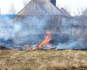 Burning grass in the village