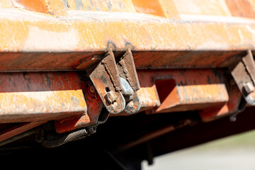 Detail of the side of a truck with a bolt and nut