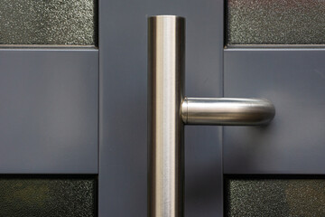 Shiny metal handle of a door