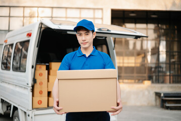 Portrait of courier delivery Asian man searching the address on digital tablet. Delivery service, delivery home and shipping concept...