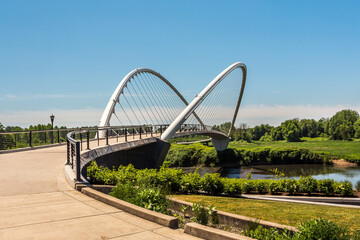 Pedestrian Peter Courtney Minto Island Bridge in the Riverfront city park in Salem, Oregon, over Willamette River