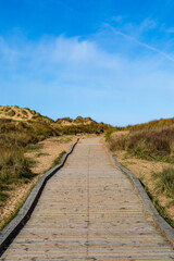 A wooden boardwalk leading to the beach, at Formby in Merseyside