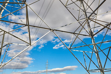 Power line tower. Energy industry. Industrial electricity distribution. Renewable production