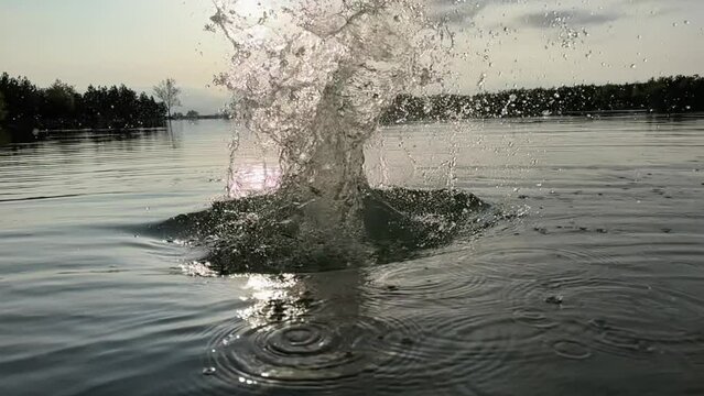 the splashing of the log thrown into the water and the creative image formed