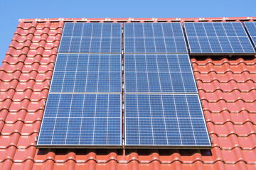 solar panels on red tiled roof