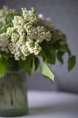 Fresh fragrant lilac flowers in the home interior