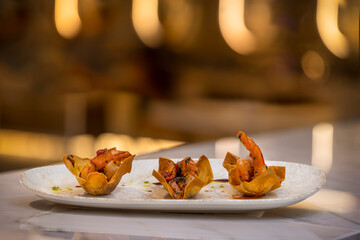 Fried shrimp on a plate in the restaurant. Shallow depth of field.