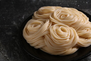 photo of spaghetti lying on a plate