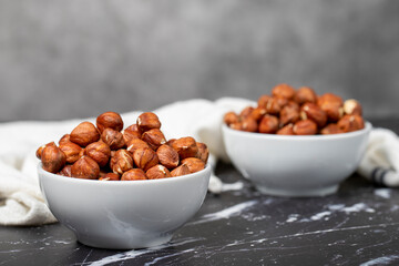 Hazelnut. Peeled hazelnuts in ceramic bowl. Superfood. Vegetarian Food concept. Healthy snacks. Close up