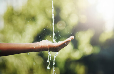 Hands, water splash and washing in nature outdoor for hygiene, health and wellness for hydration on...