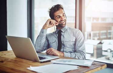 Happy businessman, laptop and call center headphones for customer service or financial advice at office. Friendly man person or consultant agent talking on headset in online consulting at workplace
