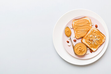 Peanut butter sandwiches or toasts on light table background.Breakfast. Vegetarian food. American cuisine top view vith copy space