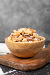 Mixed nuts. Special mixed nuts in a wooden bowl. Nuts, pistachios, peanuts, cashews, almonds. superfood Vegetarian food concept. healthy snacks. Close up