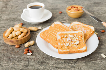 Peanut butter sandwiches or toasts on light table background.Breakfast. Vegetarian food. American cuisine top view vith copy space