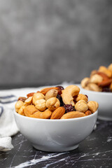 Mixed nuts. Special mixed nuts in a ceramic bowl. Nuts, pistachios, peanuts, cashews, almonds. superfood Vegetarian food concept. healthy snacks. Close up